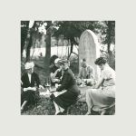 Image of a group of people having a picnic in a cemetery